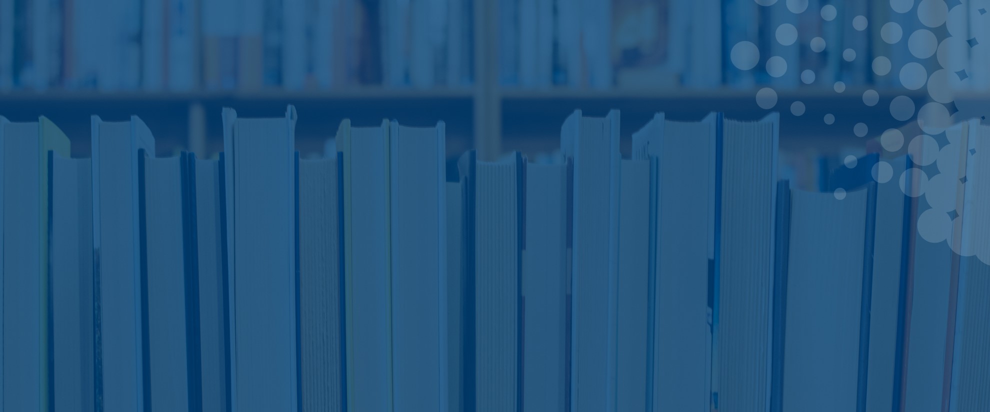 row of printed books on blue background